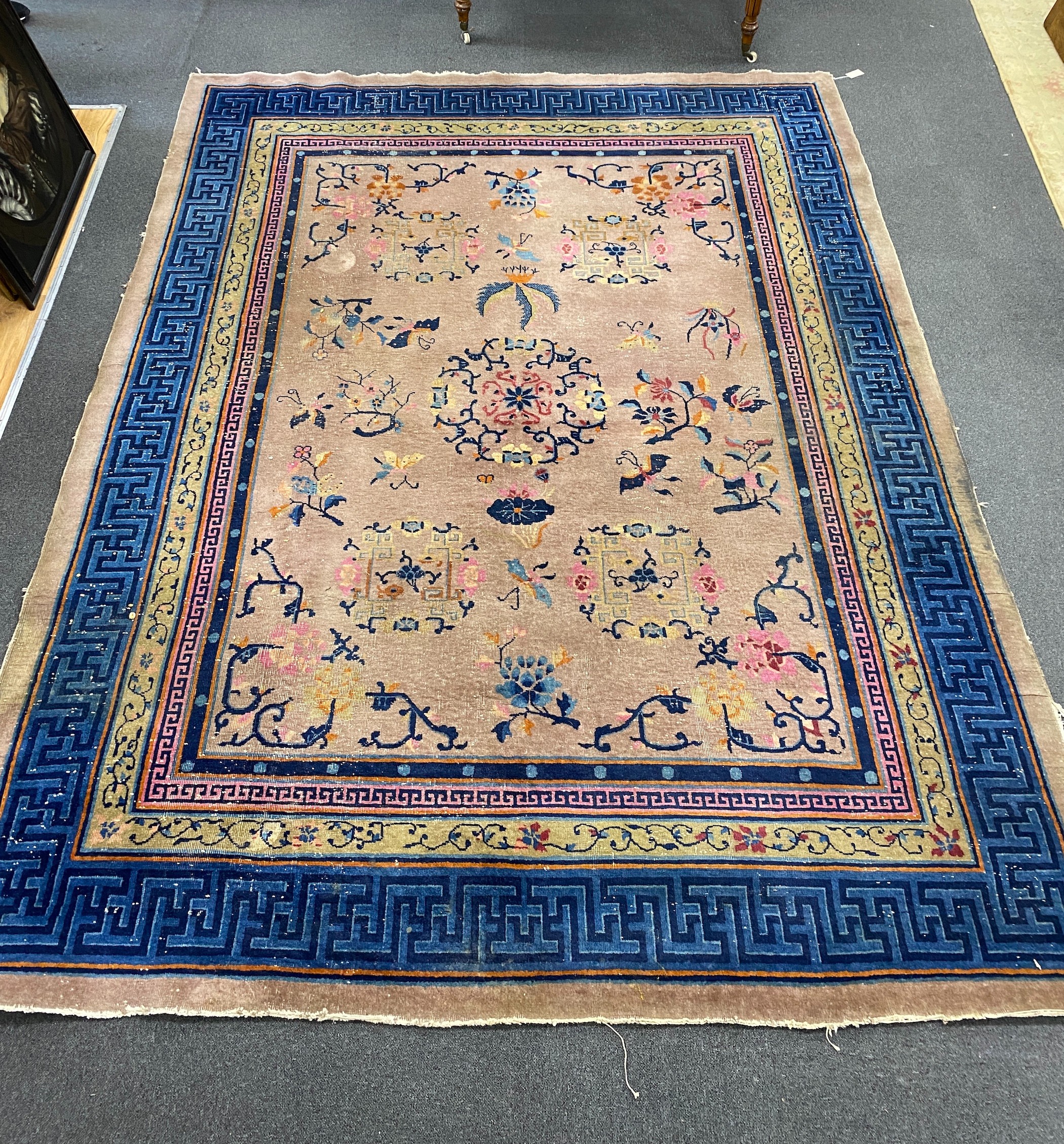 An early 20th century Chinese lilac ground carpet, 330 x 240cm